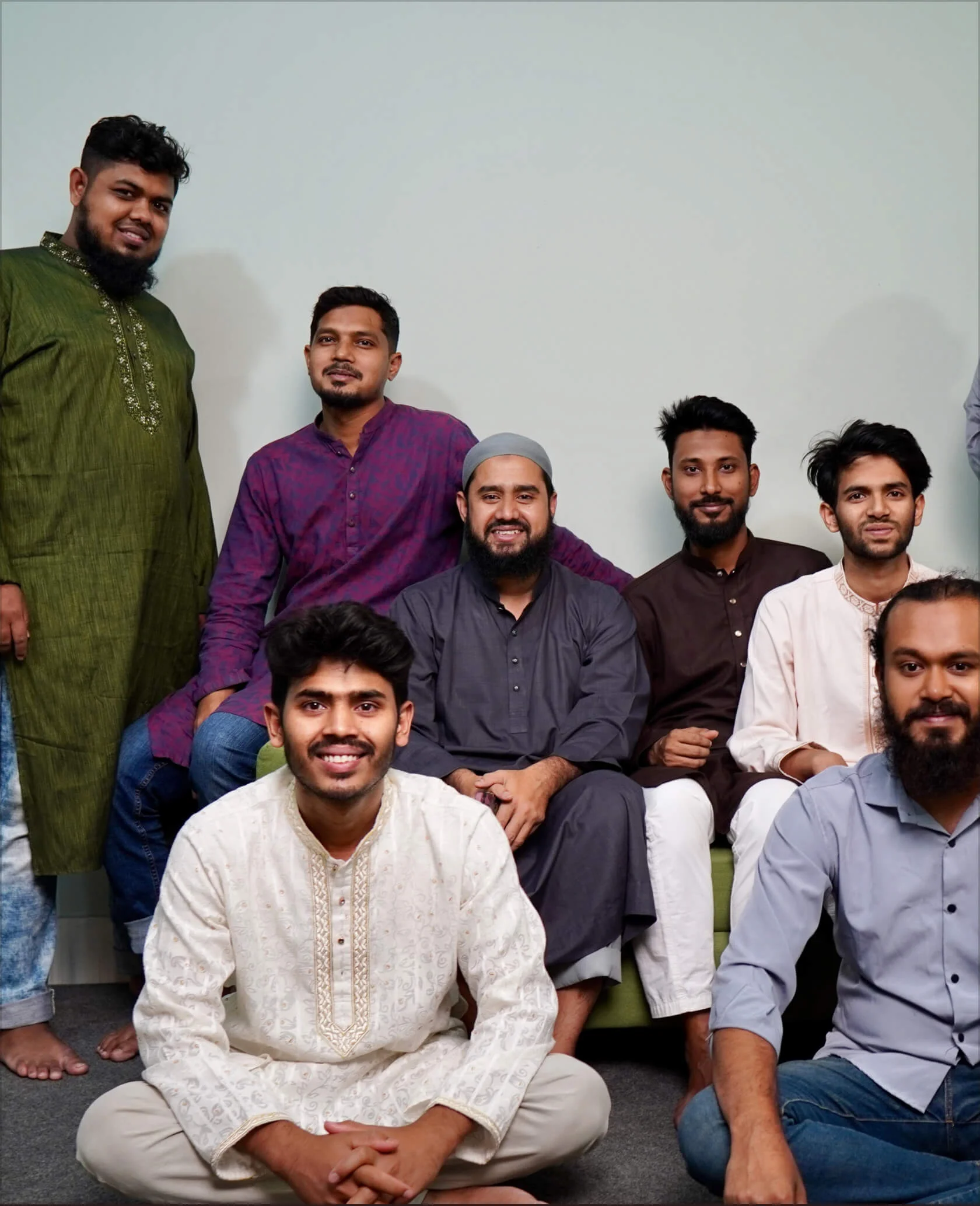 Members of the Panze team together in the studio in traditional dress