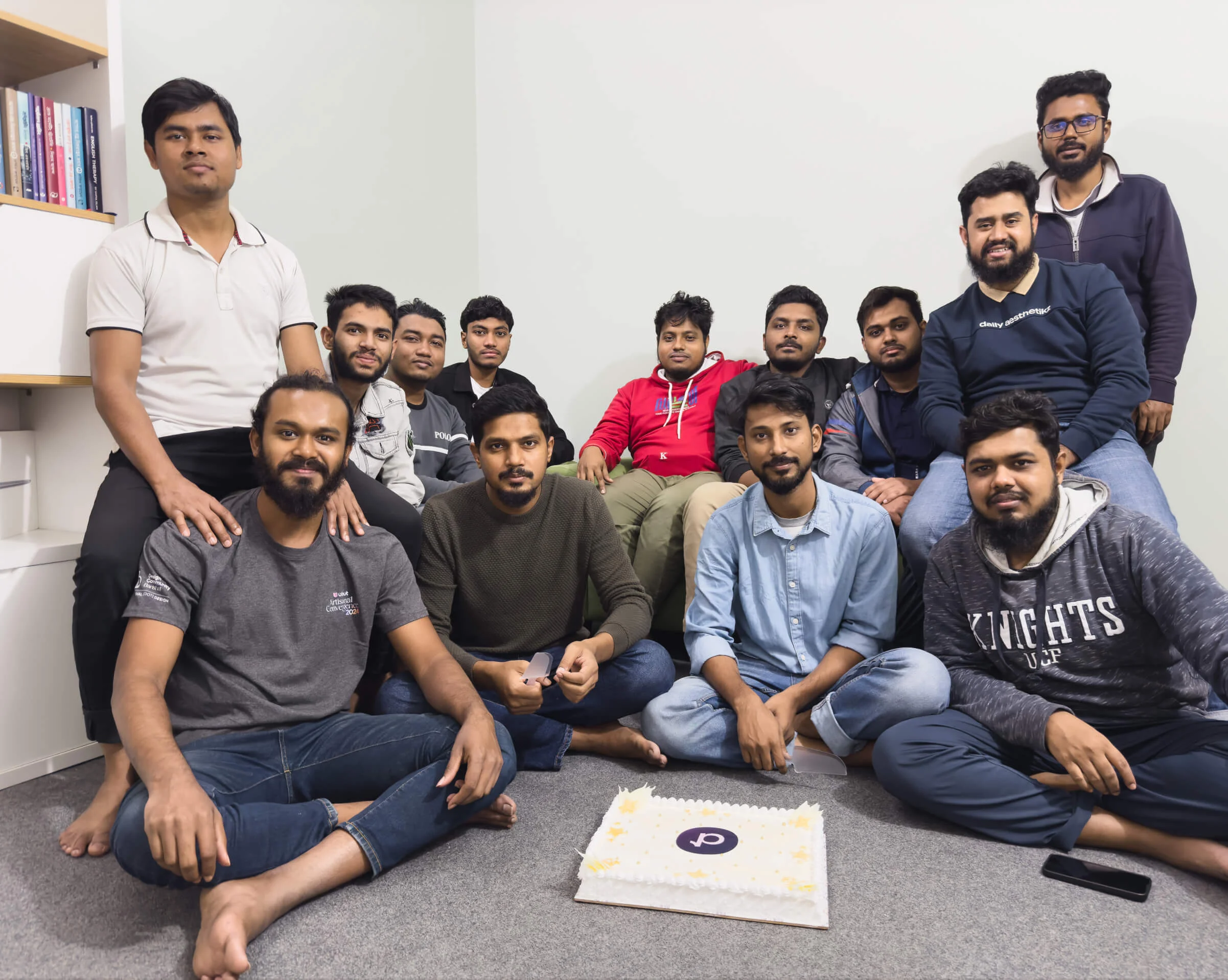 The Panze team gathered in the studio around a Panze celebration cake