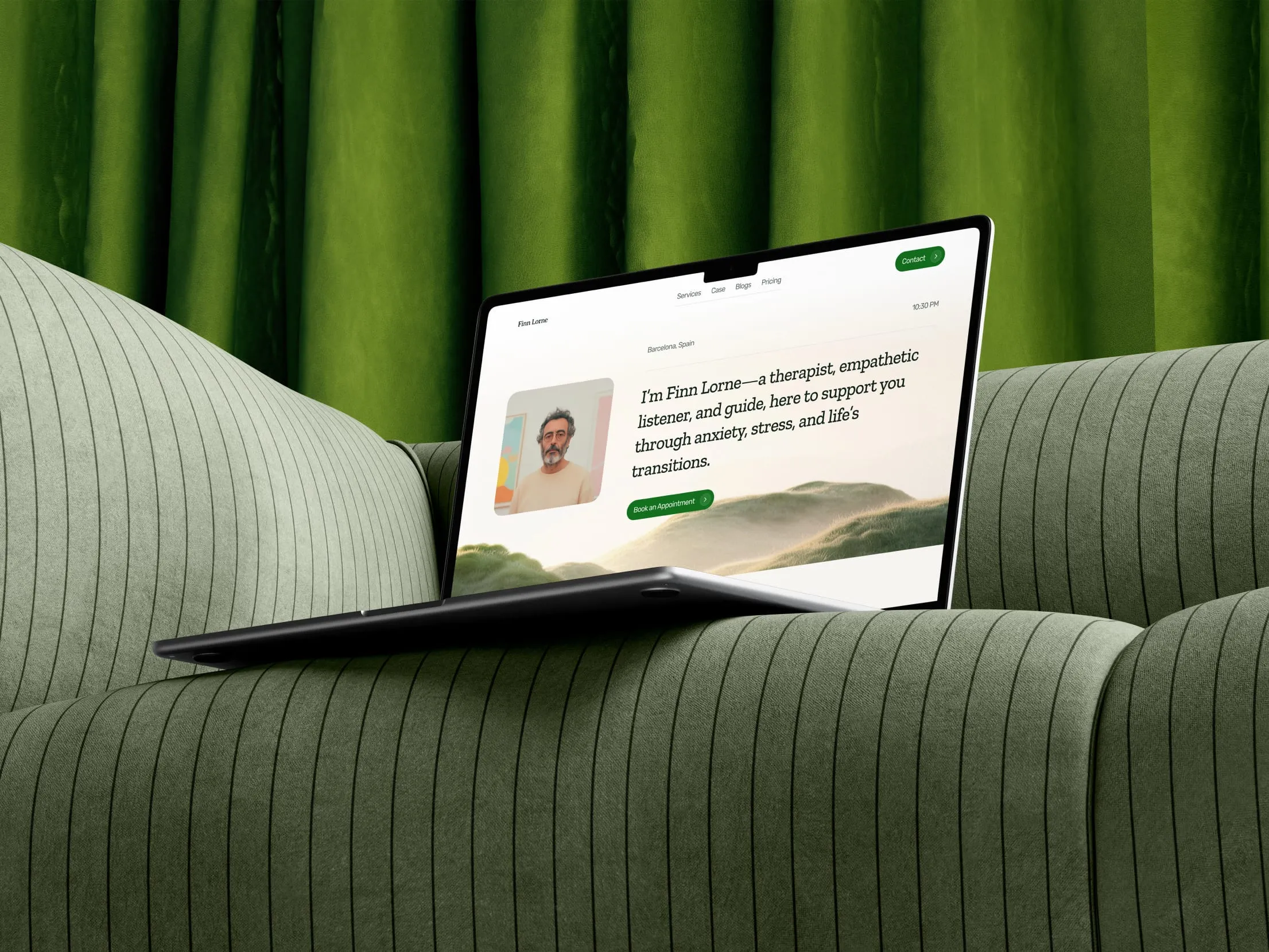 Therapist portfolio website on a laptop resting on a green sofa