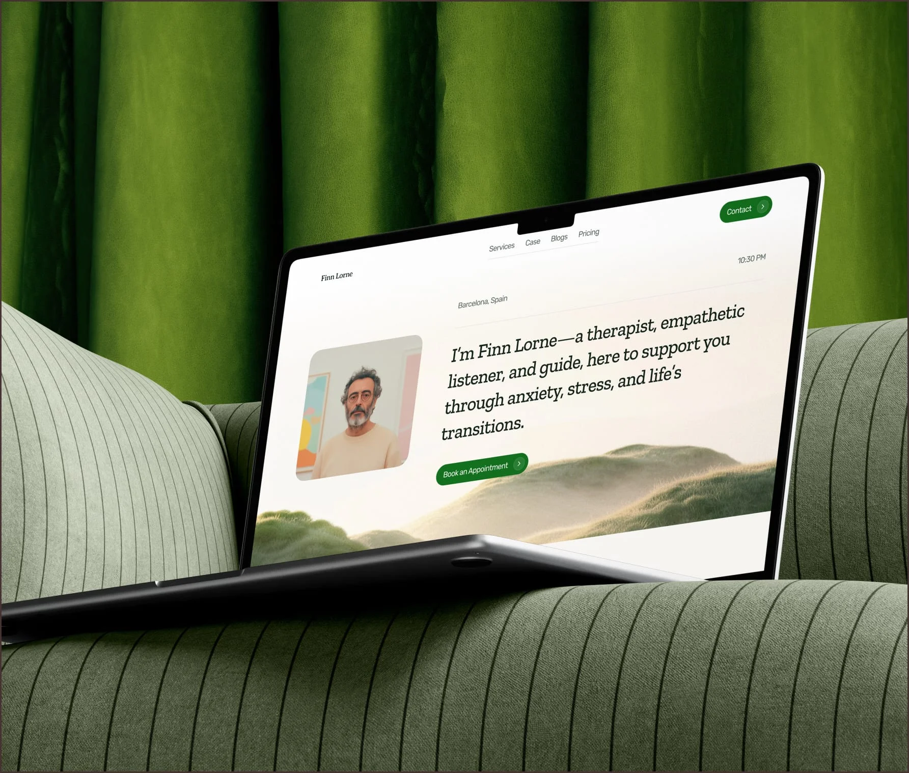Therapist portfolio website on a laptop resting on a green sofa